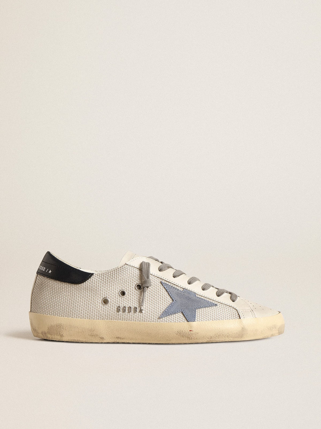 Super-Star de malla plateada pálida con estrella de ante azul claro