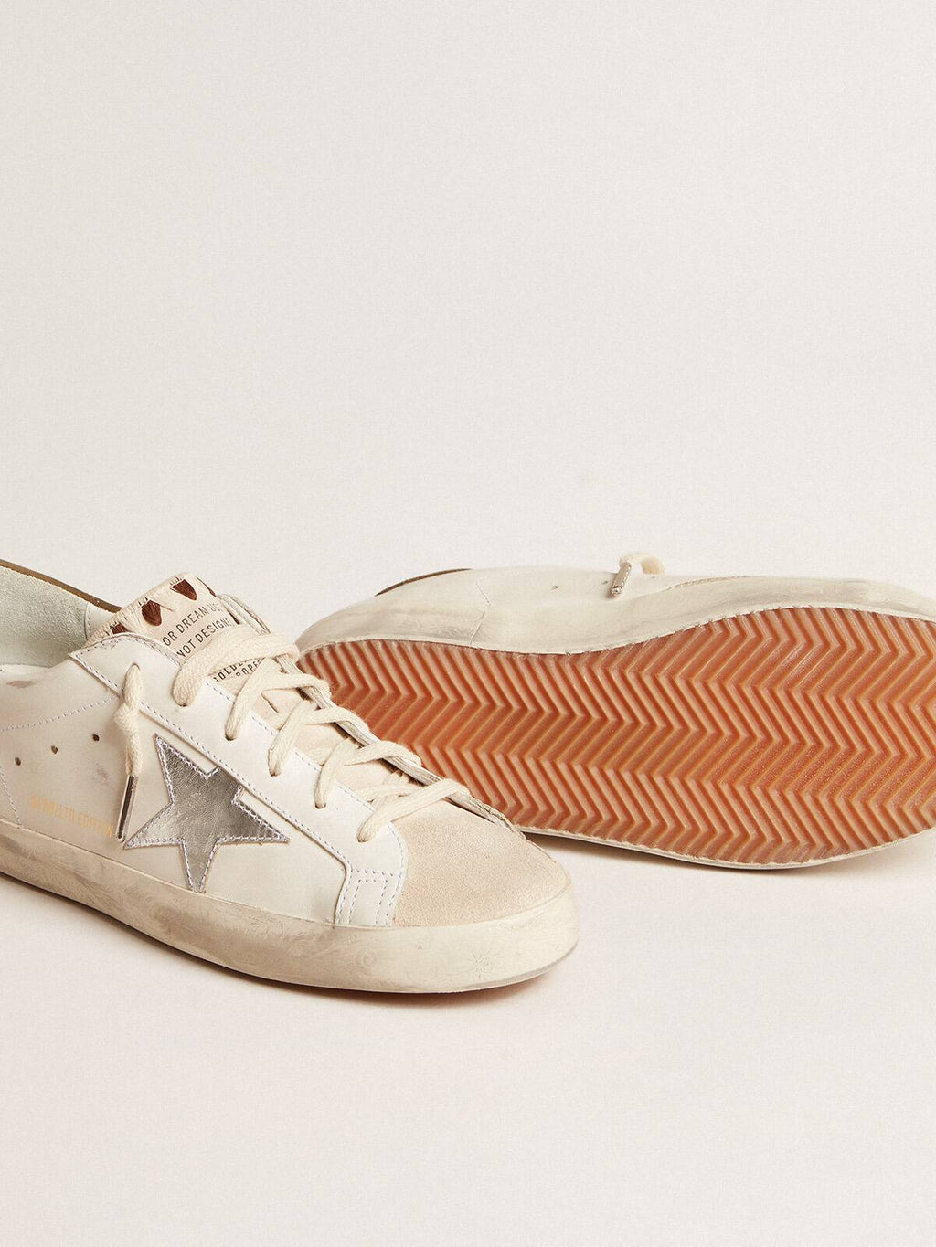 Super-Star LTD con stella in pelle laminata argento e talloncino marrone