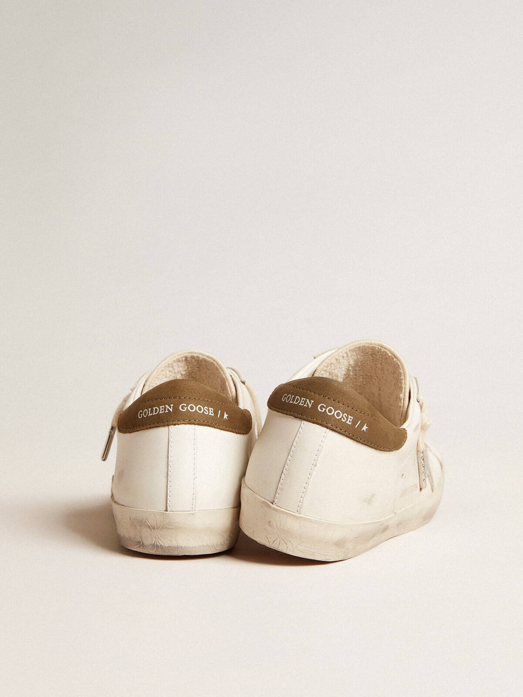 Super-Star LTD con stella in pelle laminata argento e talloncino marrone