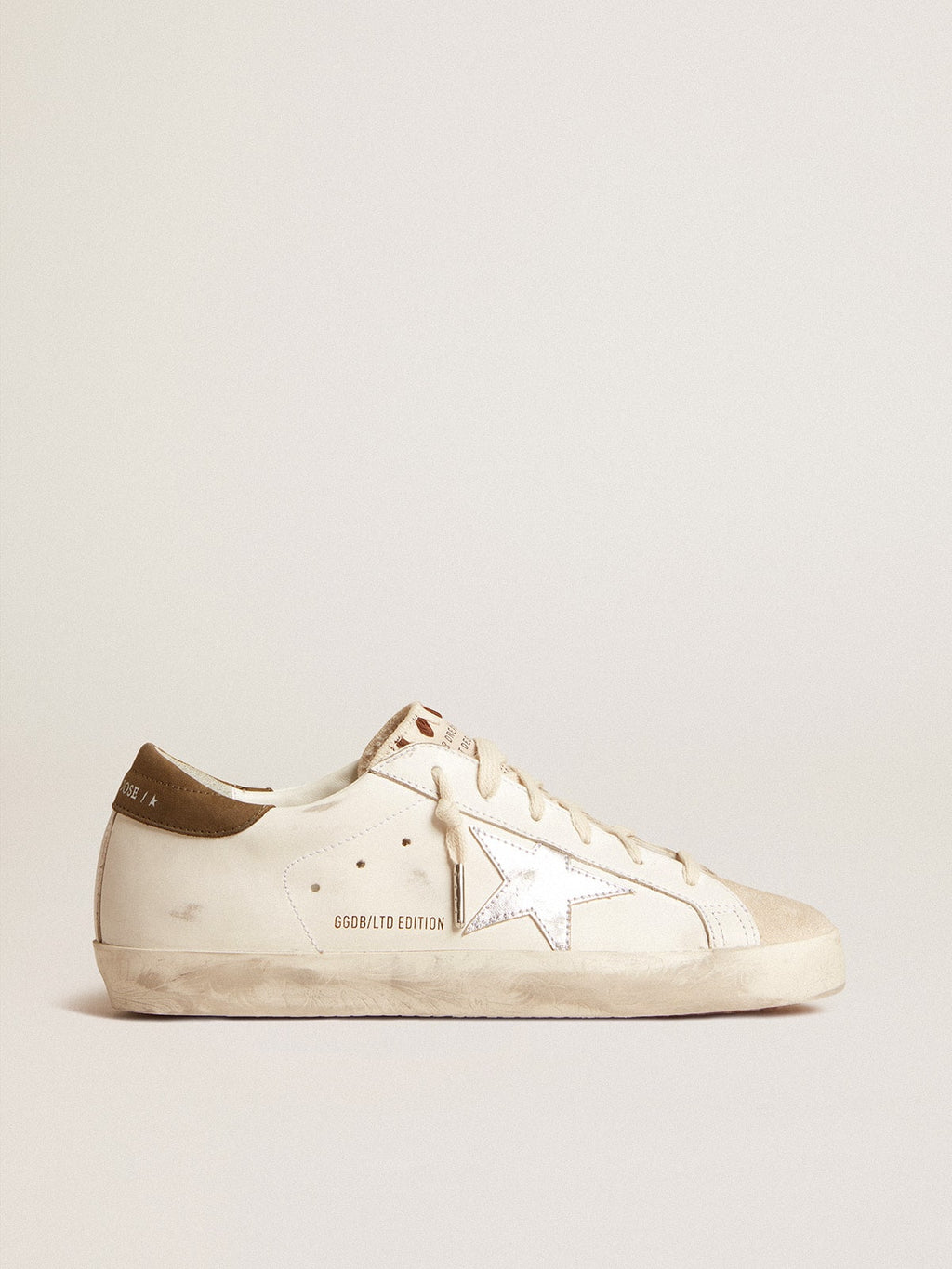Super-Star LTD con stella in pelle laminata argento e talloncino marrone