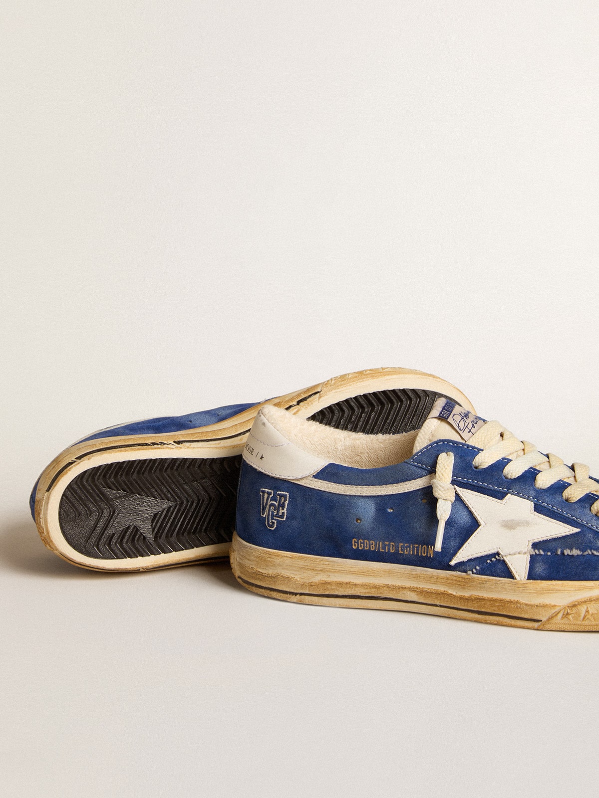 Super-Star in camoscio blu con stella e talloncino in pelle bianca